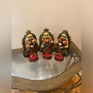 Wooden painted figurines.all playing different instuments.